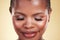 Makeup, beauty and face of a black woman in studio for self care, skin glow and cosmetics. Closeup of african person or