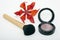 Makeup blusher rouge and brushes with orange lily