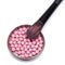 Makeup brush on jar with shimmer blush balls