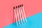 Makeup brushes on colorful background with hard shadow