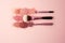 Makeup brushes with crushed eyeshadow palette on pink background - Ai Generated