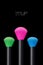 Makeup concept. Colorful Make up brushes over black background