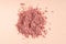 Makeup cosmetics. Eyeshadow or blush crushed palette, colorful eye shadow powder on beige background