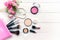 Makeup cosmetics tools background and beauty cosmetics, products and facial cosmetics package lipstick, eyeshadow with rose and pe