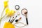 Makeup cosmetics tools and beauty cosmetics gift, products and facial cosmetics package lipstick with yellow flower on the white b