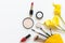 Makeup cosmetics tools and beauty cosmetics gift, products and facial cosmetics package lipstick with yellow flower on the white b