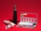 Makeup items on red background with high-contrast lighting