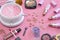 Makeup Items on Vintage Pink Wood Table