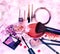 Makeup products and jewelry on floral background