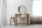 Makeup room interior with wooden table and mirror near wall