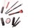 Makeup tools. Face brushes, lipstick, mascara and powder. Cosmetic accessories on a white background. Women`s fashion.