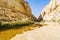 Makhtesh Ramon crater mountains park view trekking path with water - geological site in Negev desert