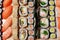 Maki and nigiri, sushi with fish, fresh salmon, shrimp and cheese, avocado rolls. Futomaki and Philadelphia with California. Set
