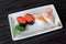 Maki sushi with flying fish roe and salmon grilled nigiri sushi