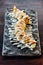 Maki Sushi with Rice, Shrimp Tempura, Avocado and Cheese inside covered Crispy Tempura Flour. Topping with Teriyaki Sauce and Mayo