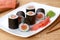 Maki sushi roll with salmon, wasabi, ginger and