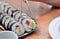 Maki sushi rolls japan food on plate eating with foodsticks