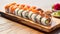 Maki Sushi Rolls set on wooden bamboo board.