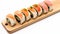 Maki Sushi Rolls set on wooden bamboo board.