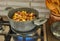 Making Alsatian sauerkraut in saucepan on a gas stove. French gourmet food