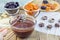 Making apricot and prunes lollipops with chocolate and macadamia nuts