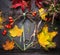 Making autumn wreath on dark florist table
