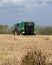 making bales tractor working in rice harvest season