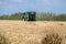 making bales tractor working in rice harvest season