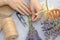 Making a bouquet of fresh lavender. Step by step photo of a woman\'s hand tying a bunch of lavender