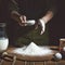 Making bread, retro styled imagery. Grain added.Bakery. Preparation of bread dough.