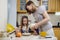 Making breakfest. Mom teach daughter to cook