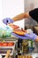 Making burgers. Preparing a hamburger in a protective gloves, in a food truck, in a fast food restaurant, close up.