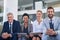 Making business better together. Portrait of a group of businesspeople sitting in an office.