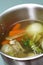 Making chicken bouillon in a pot