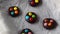 Making chocolate cookies with multicolored candy drops