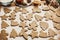 Making christmas gingerbread cookies. Raw dough in shape of gingerbread man,christmas tree, star, deer on paper and  anise,