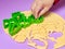 Making cookies in the form of various figures. Woman confectioner with the help of plastic molds forms from the dough cookies for