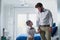 Making Dad look good from day one. an adorable little boy and his father dressed in matching outfits.