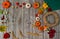 Making decorations  on the door of handmade textile pumpkins and natural materials.  Wreath, autumn leaves, berries and cereals