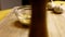 making Dijon mustard and lemon juice salad dressing, vertically, close-up, slow motion, stirring ingredients in glass