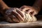 Making dough by hands on sprinkled with flour on wooden table background