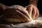 Making dough by hands on sprinkled with flour on wooden table background