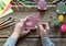 Making Easter decoration - easter eggs and bunny. Painting and coloring wooden toy of brushes and gouache. Creative process.