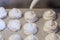 Making French meringue cookies on parchment paper