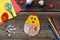 Making of handmade Easter decoration. Child made greeting card from eggshell. Childrens DIY concept, gift with your own hands.