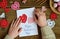 Making of handmade Valentine greeting card with crochet openwork hearts. Making of handmade decoration. Valentines Day crafts.