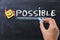 Making the impossible possible concept on blackboard background