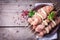 Making kebab from chicken - raw meat on skewers on plate