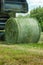 Making large roll of hay for livestock