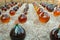 Making of natural sweet dessert muscat liqueur white wine outside in big round glass antique demijohn bottles in Frontignan, south